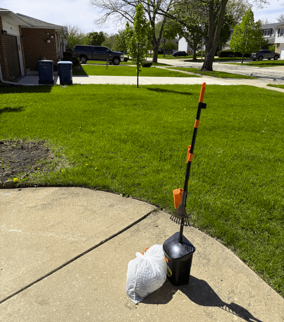 Professional pet waste removal tools including pooper scooper, deodorizer, and secure gate check for reliable yard cleanup service